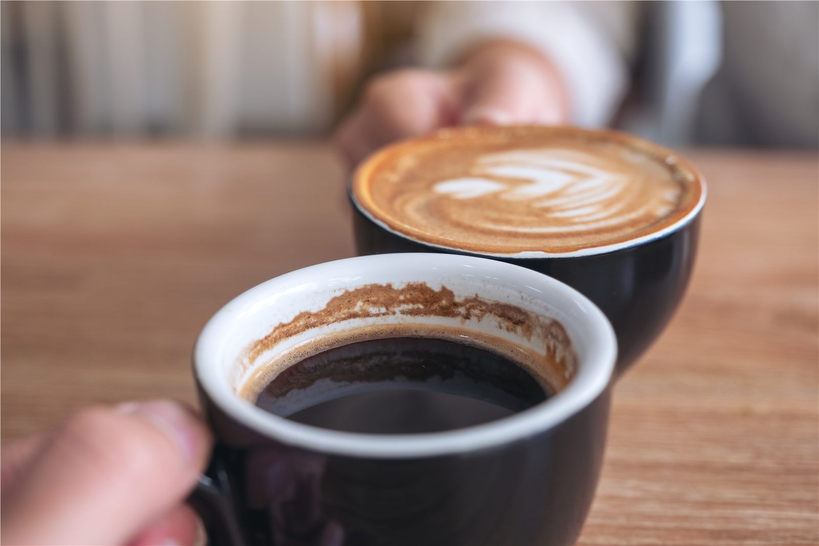 Two people sharing coffee together