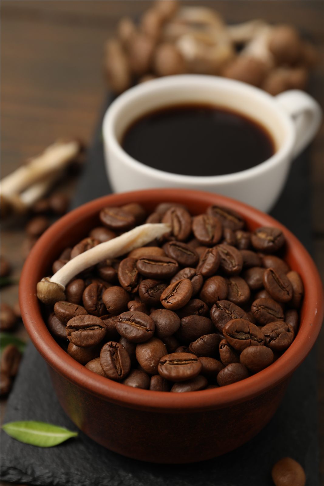 Black coffee with roasted coffee beans