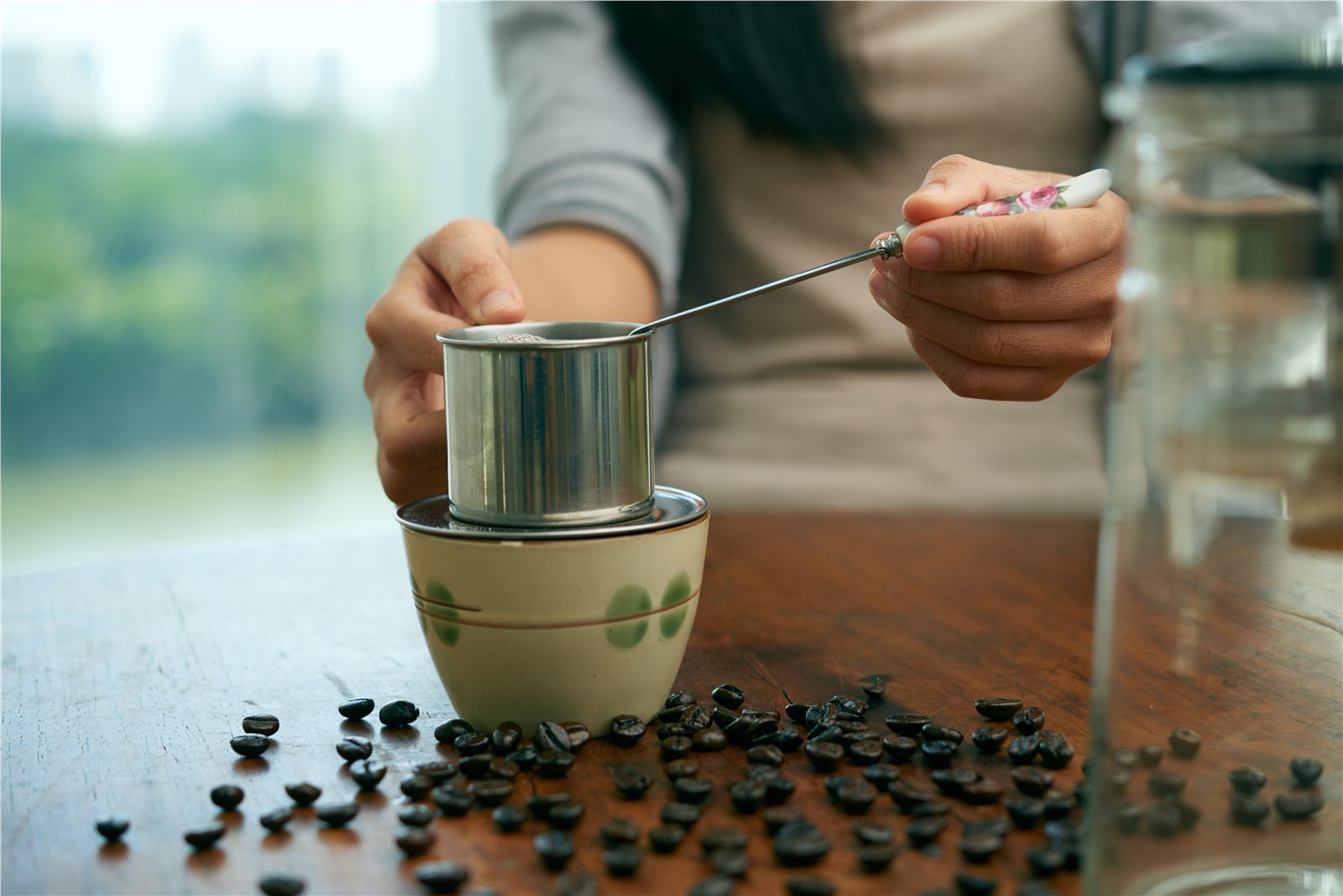 Traditional Vietnamese coffee brewing with a steel phin filter